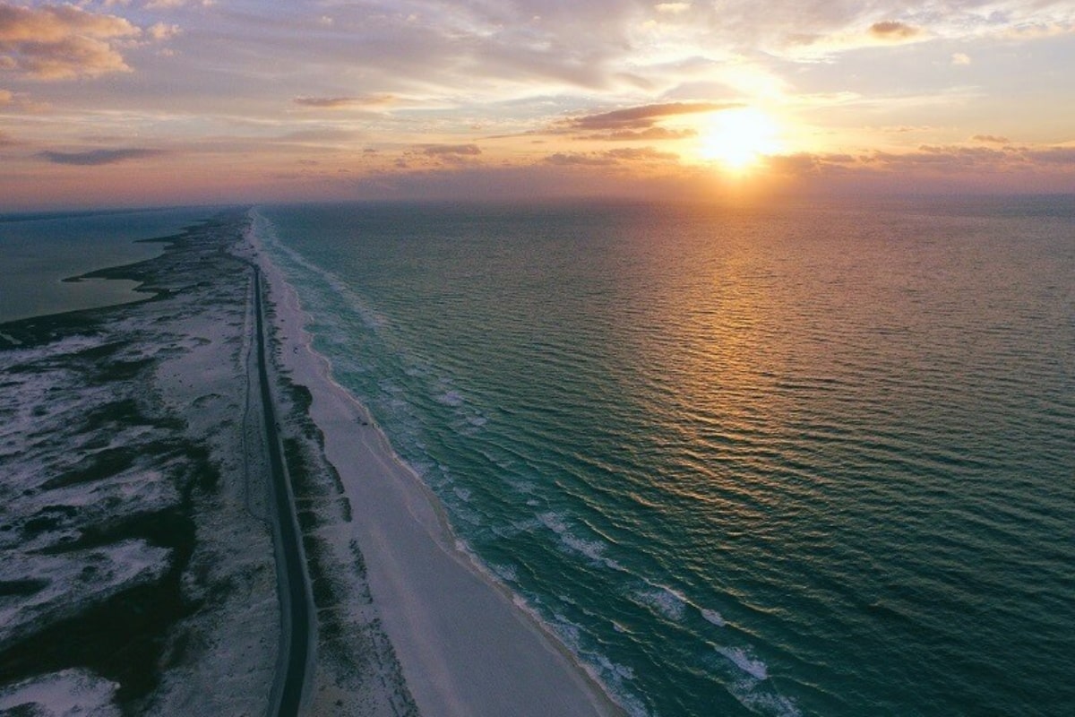 overlook of beach, ocean during sunset, representing moving to a state with lower taxes