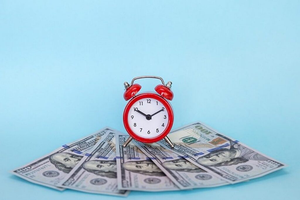 Alarm clock on row of paper money representing time running out on Estate Planning opportunity