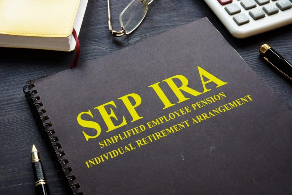 Picture of a black SEP-IRA booklet on a desktop