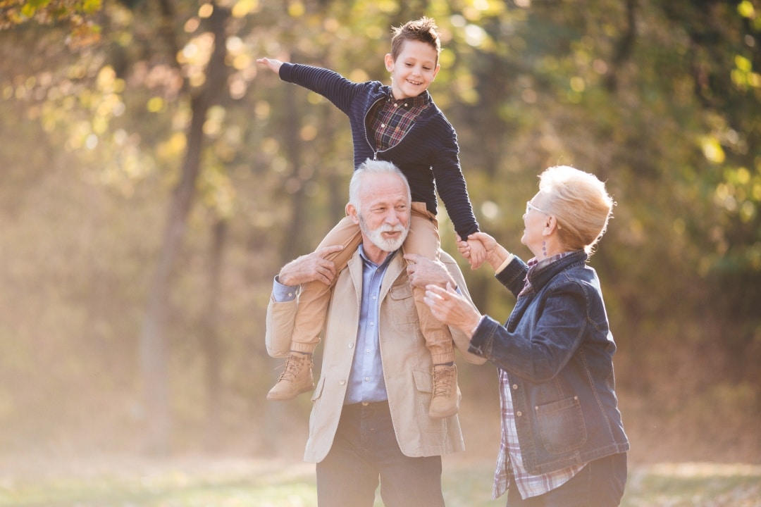 Picture of senior couple and child representing Grandparents creating a trust for their grandchildren